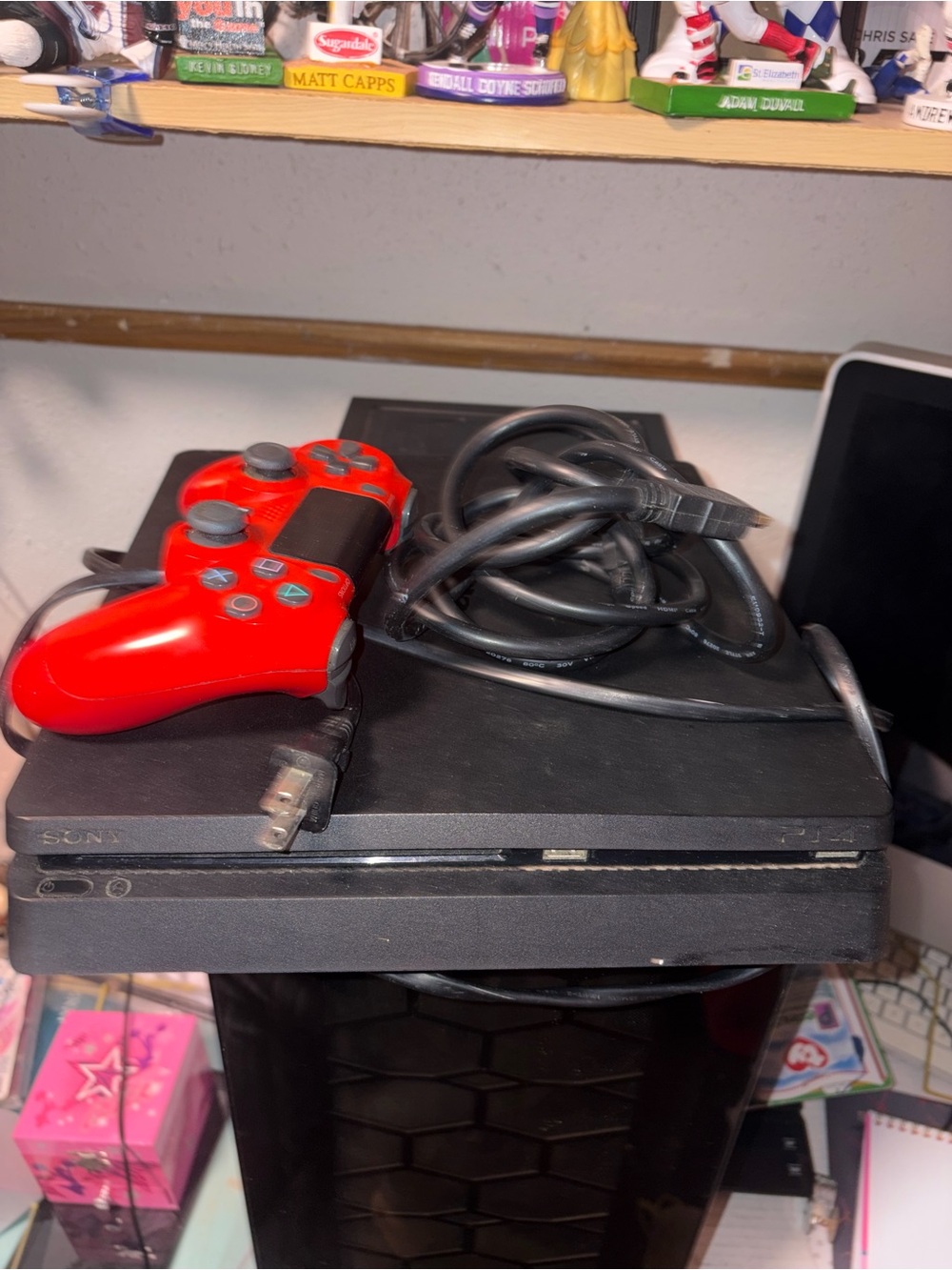 Sony Black Console with Bright Red Wired Controller